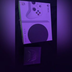 Xbox s with the original cords, controller and box. Also a second controller